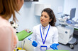 © Graphicroyalty - Gynecologist talking to patient in clinic. Female doctor in white coat and blue gloves consulting young woman in medical office. Healthcare and medicine concept. Specialist explaining diagnosis.