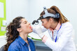 © Graphicroyalty - ENT throat examination. Deep throat check, People with respiratory health problem, Healthcare And Medicine concept. Female otolaryngologist using headlamp and spatula to examine patient throat.