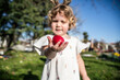 © ADDICTIVE STOCK - Little girl celebrating Easter with a red egg