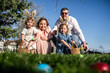 © ADDICTIVE STOCK - Family enjoying Easter egg hunt in the springtime