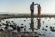 © ADDICTIVE STOCK - Couple dancing by the seaside during sunset