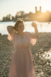 © ADDICTIVE STOCK - Woman enjoying sunset at the beach