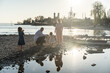 © ADDICTIVE STOCK - Family enjoying a serene beach day together