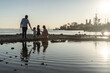 © ADDICTIVE STOCK - Family at the beach enjoying a sunny day near the water