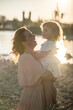 © ADDICTIVE STOCK - Mother and child sharing a joyful moment outdoors