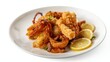© VolumeThings - Spicy fried squid tentacles on a white plate with potatoes and lemon, isolated on white