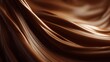 © 123sasha - Smooth dark chocolate melts and flows in waves under soft light during a warm culinary setting