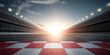 © sornram - A stunning perspective of a racetrack at sunrise, highlighting the checkered finish line with bright stadium lights in the background.