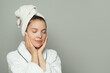 © artmim - Cute woman taking care of her skin wearing sheet mask. Skin care and hydration concept