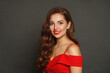 © artmim - Successful brunette woman with trendy make-up and brown curly hair wavy hairstyle and red lips makeup on black background