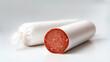 © Alexandr Bognat - Sausage chub cut in blank white pack mockup, ai generate. Empty plastic cover on preserved salami half lying mock up, depth of field background. Sealed meat pepperoni package template.