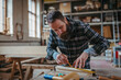 © Halfpoint - Male carpenter working on his product in workshop. Small business concept.