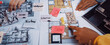 © InfiniteFlow - A vibrant workspace showcasing a collaborative approach to interior design. Hands actively engage with layouts, color swatches, and design notes for creative inspiration. SACTR