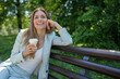 © SISMIZ - Businesswoman enjoying spring in the park