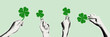 © Olga Tsikarishvili - Halftone hands holding green four leaf clover. St Patrick’s Day good luck symbol. Lucky charm. Retro pop art collage elements for mixed media design. Vector Illustration for 17 march card