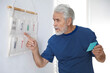 © New Africa - Amnesia. Senior man trying to remember his weekly schedule at home