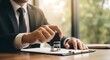 © Sangida - Businessman applying stamp to a document in office