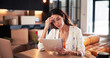 © EineroLens25/peopleimages.com - Worry, woman and reading document at new house for property purchase, agreement and hidden fees. Concern, female person and contract with legal terms, lease cost and review information for relocation