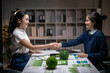 © Apichat - Businesswomen shaking hands after esg agreement