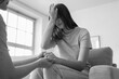 © Pixel-Shot - Young woman supporting her friend with suicidal thoughts on sofa at home