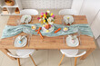 © Pixel-Shot - Beautiful table setting for Easter decorated with bouquet of carrots and flowers in dinning room