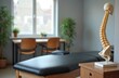© Viktor - Chiropractic office exam room with treatment table and spine model. Medical equipment for physical therapy and body wellness. Healthy interior for patient care.