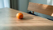 © takayuki - 木目のテーブルに置かれたみかん 自然光が差し込む部屋 ミニマルな静物 / Fresh oranges on wooden table with dramatic natural light and shadows, minimalist still life