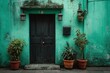 © ART BY SAIFUL - Vibrant photo of Vintage black wooden door on a weathered green wall with terracotta potted plants