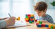 © Studio Nova - The boy concentrating on colorful wooden blocks during a developmental play assessment session