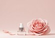 © Mowshum - Pink rose and cosmetic bottle on pink background with flower petals  beauty and skincare product