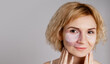 © MarijaBazarova - Woman with visible port-wine stain birthmark vascular skin condition wearing  hydrogel under eye patches for skincare beauty routine showing natural diversity authentic representation self-confidence