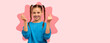 © Prostock-studio - A young girl smiles and makes hand gestures while wearing a blue shirt. Her hair is styled in pigtails. The background has a colorful collage effect that adds interest.