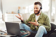 © Prostock-studio - Man Making Video Call Using Laptop Computer Sitting Wearing Headset Communicating Online At Home. Male Freelancer Talking To Webcam Working Distantly. Remote Communication