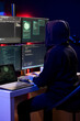 © DC Studio - Hacker doing phishing attacks tricking users into revealing credit card data. Man using PC, launching DDoS attacks flooding servers to crash websites and disrupt services