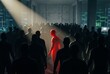© Meow Creations - Vibrant red silhouette illuminated by spotlight in crowd of black figures