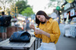 © Laingzaifa - Asian women enjoy delicious street food at night markets, smiling throughout their vacation, exploring the city's culture, vibrant lights, and fun-filled adventures.