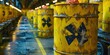 © Saad - Row of Old, Rusty, Yellow Radioactive Waste Barrels