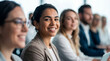 © IBEX.Media - Smiling businesswoman looking at camera in a meeting row, representing professional confidence and teamwork