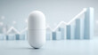 © pattozher - Pill and Growth Chart: A pristine white pill stands center stage, juxtaposed against a blurred backdrop of an upward-trending growth chart.