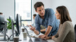 © Svetlanamax - Coworker explaining task to colleague at office desk