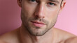 © JoeyMarut - Young man close up portrait with soft natural shadows on skin and gentle expression against pink background