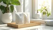 © budisantosostudio - FlyPro Firefly Plant-based laundry detergent strips in minimalist packaging, elegantly presented on a natural wooden tray with bright sunlight.