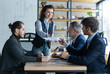 © opolja - Happy middle aged business woman discussing project management working with colleagues company team at office