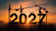 © sornram - A captivating sunset silhouette of construction cranes and the year 2027, symbolizing growth and future possibilities.