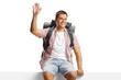 © Ljupco Smokovski - Male backpacker sitting on a blank panel and waving
