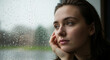 © Wallace - Melancholic Young Woman with Natural Beauty Gazing Out a Window on a Rainy Day, Deep in Thought and Contemplation