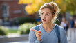 © Kateryna - Faceless young female student outdoors surprised with expressive gesture pointing finger to side casual education scene campus life student lifestyle outdoor learning academic