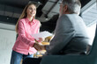 © opolja - Handshake of happy young business woman and mature business man at office meeting