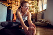© Davor - Young woman stretching on yoga mat at home