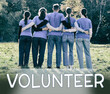 © New Africa - Team of volunteers in park, back view